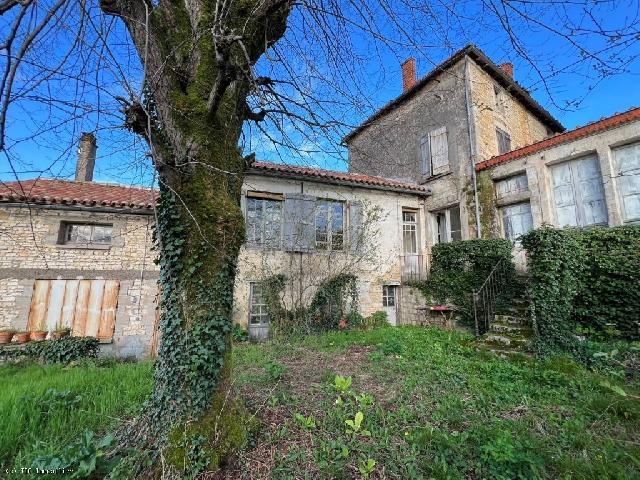 House for sale RUFFEC 16700 Charente Poitou-Charentes France: Town House with Garden, Garage and Outbuildings. Situated in the centre of town, a stone's throw from shops, schools and all amenities, this charming three-storey house offers a unique living environm...
